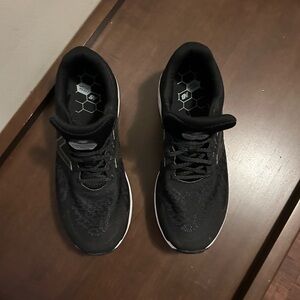 Size 9.5 men’s New Balance running shoes.